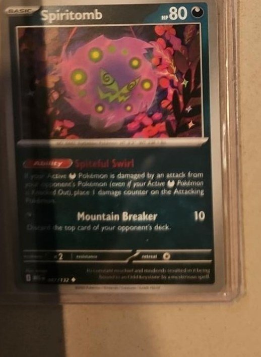 Spiritomb 087/132 — Mega Evolution photographed in the Laurarium Card Garden collection